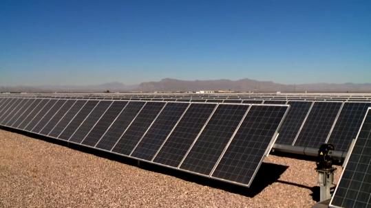 Close-up of solar panels in a field.